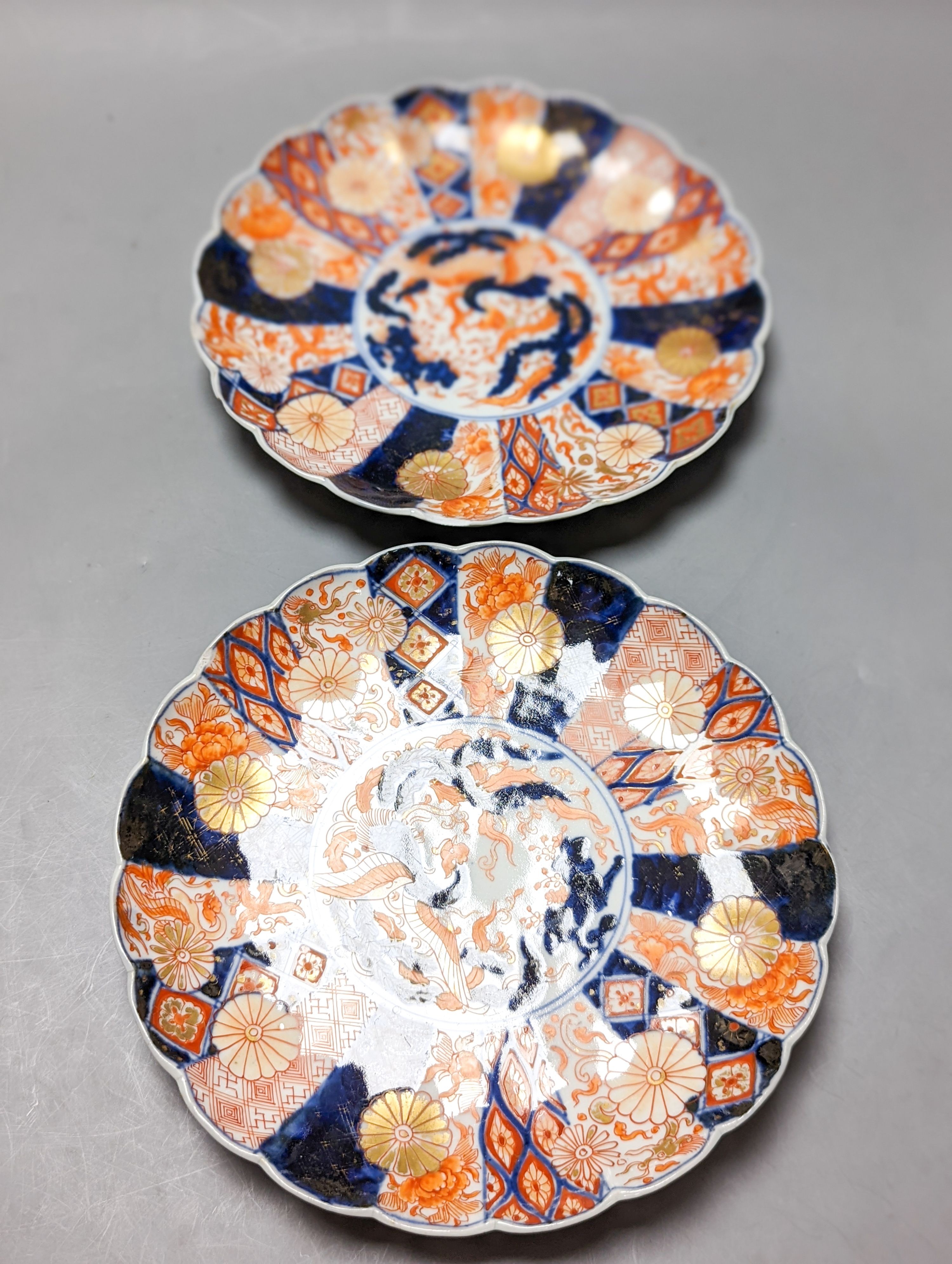 A 19th century Chinese porcelain bowl, transfer printed pillow, a Japanese Imari jar and cover and three Imari plates 21cm